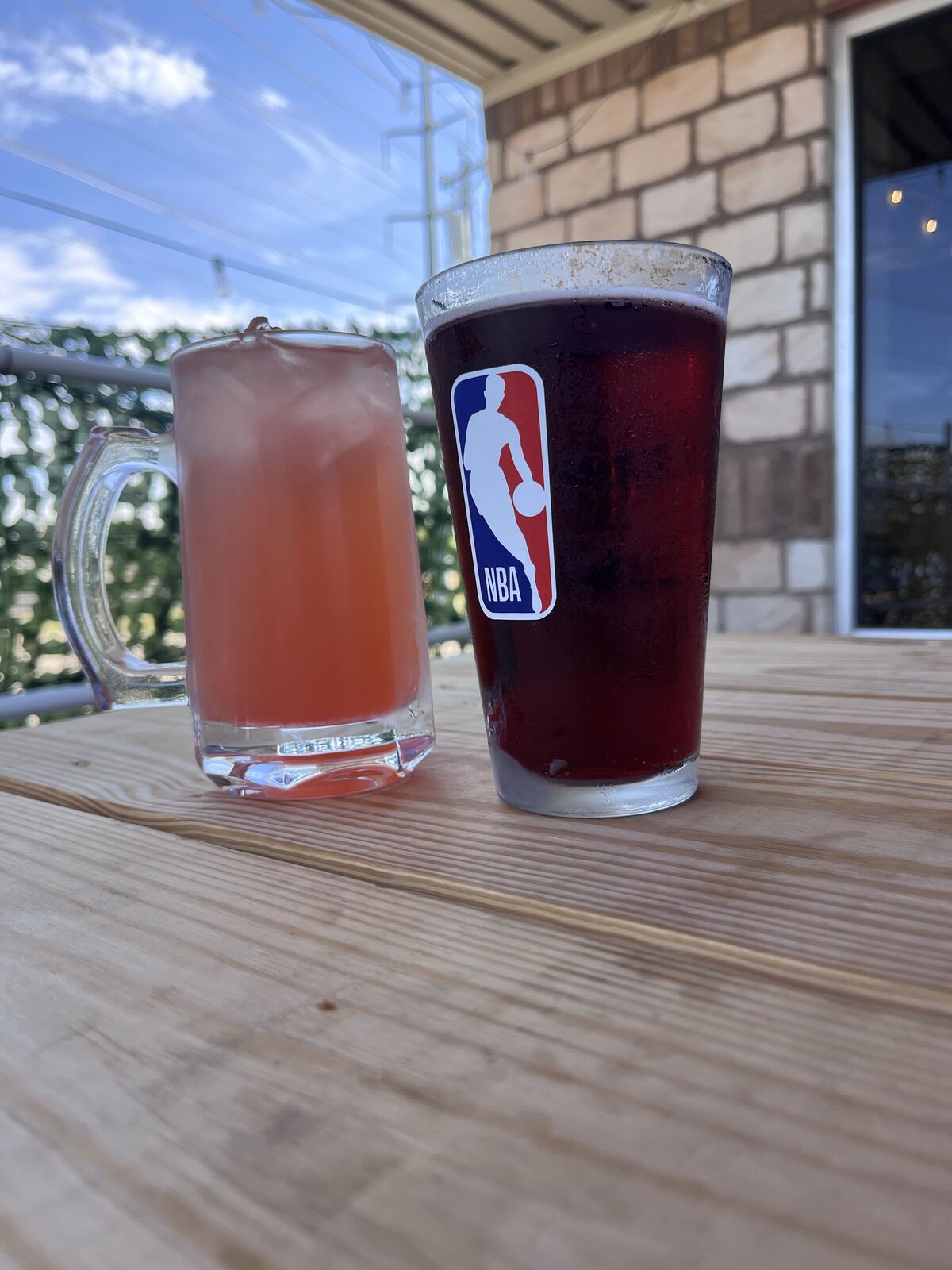 Two drinks on the patio at sunset